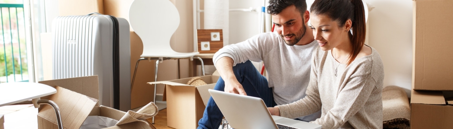 Young couple signing up for Payless Power Electricity online