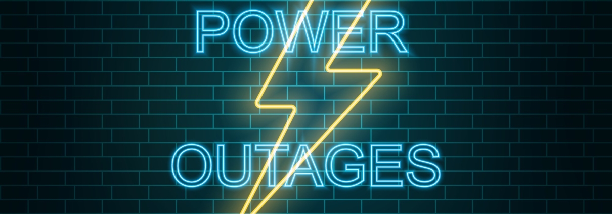 What is the difference between a blackout and a brownout in electricity terms?